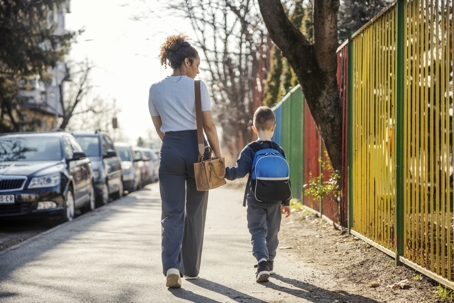 mother and son walking to school